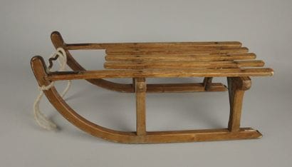 Vintage wooden sled with metal runners
70...