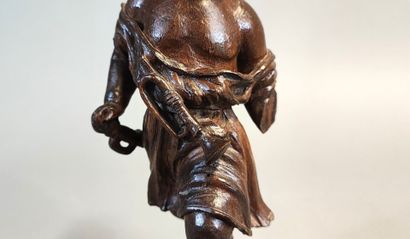 Putto with bugle. Wooden statuette carved...