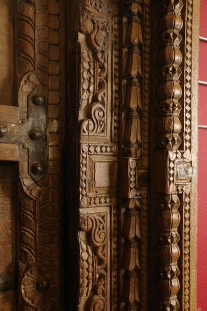 Frame with two natural wood doors richly...