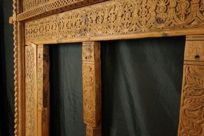 Antique wooden facade richly carved with...