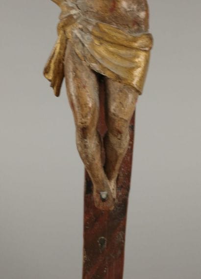 Crucifix: a polychrome carved wooden figure...