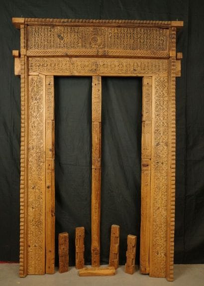 Antique wooden facade richly carved with...
