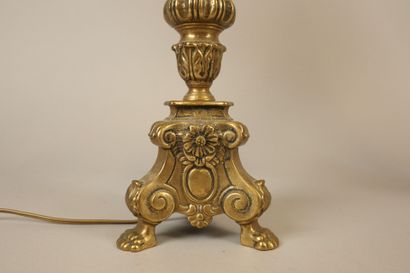 Pair of bronze candlesticks resting on a...