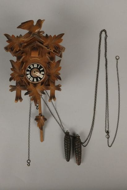 Black Forest-style wooden cuckoo clock with...