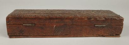 Set includes: - A carved wooden box with...