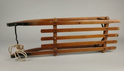 Vintage wooden sled with metal runners
95...