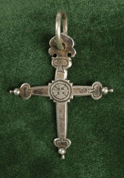 Silver Jeannette Cross with a chased St....