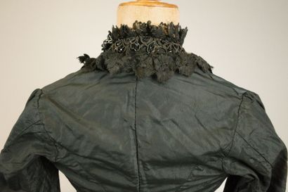 Bodice from around 1880. Made of black silk...
