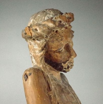 Carved wooden Christ in bonds with traces...