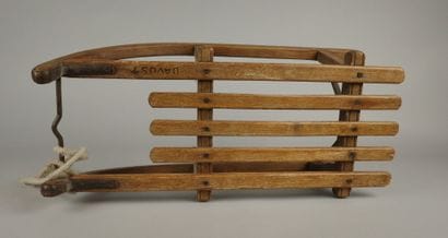 Vintage wooden sled with metal runners
70...