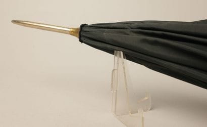 Black nylon parasol, with a black leather-covered...