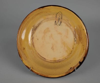 Glazed ceramic dish with a polychrome floral...