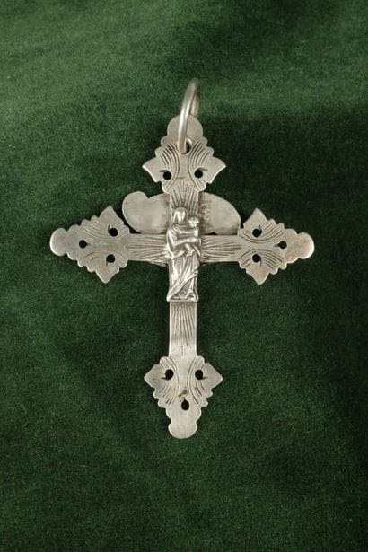 Large silver lattice cross depicting Christ...