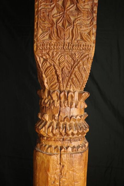 Two carved pine columns with consoles decorated...