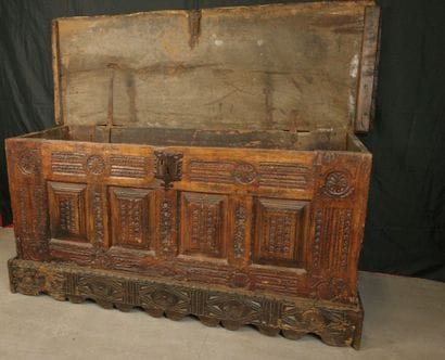 Large natural wood chest with a paneled front...