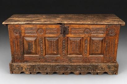 Large natural wood chest with a paneled front...