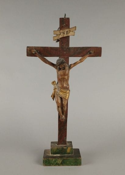 Crucifix: a polychrome carved wooden figure...