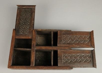 Set includes: - A carved wooden box with...