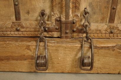 Frame with two natural wood doors richly...