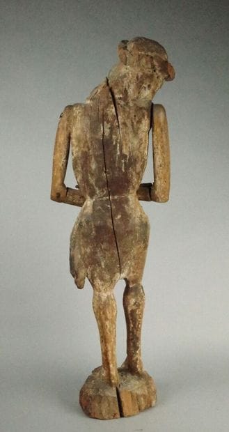 Carved wooden Christ in bonds with traces...
