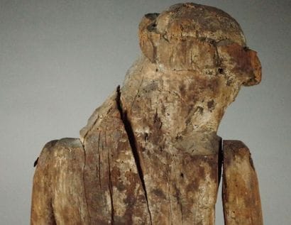 Carved wooden Christ in bonds with traces...