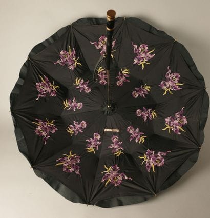 Black nylon parasol, with a black leather-covered...