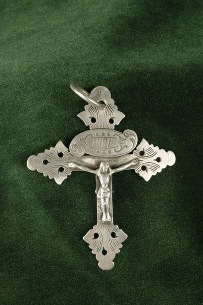 Large silver lattice cross depicting Christ...