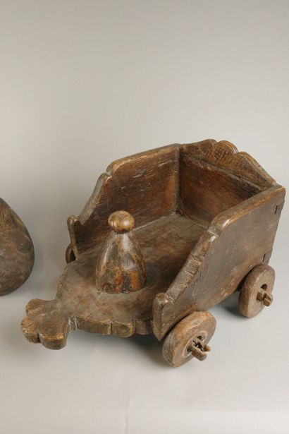 A small coffee table made of wood carved...