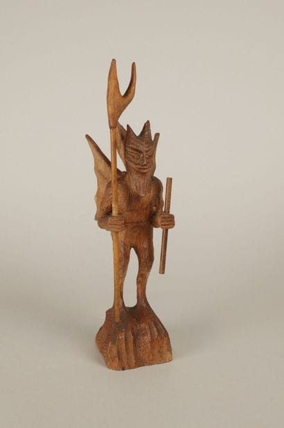 20th century. Winged devil holding pitchfork...