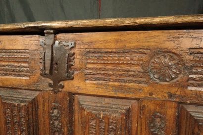 Large natural wood chest with a paneled front...