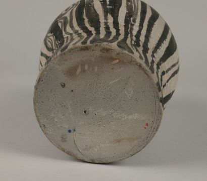 Gray ceramic carafe designed to resemble...
