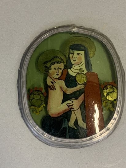 Oval medallion depicting the Virgin and Child,...