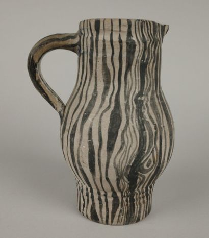 Gray ceramic carafe designed to resemble...