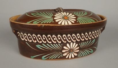 Brown glazed terracotta baeckeoffe dish decorated...