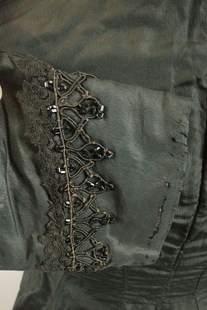 Bodice from around 1880. Made of black silk...