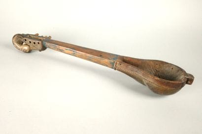 Set including a wooden rattle, a two-compartment...