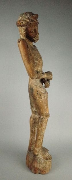 Carved wooden Christ in bonds with traces...