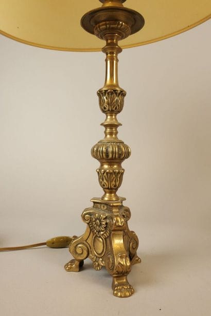 Pair of bronze candlesticks resting on a...