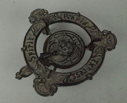 Small cast-iron Art Nouveau-style three-legged...