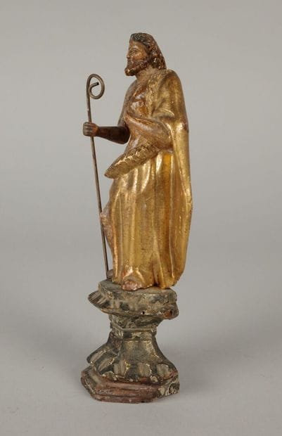 Saint holding a crosier in his right hand,...
