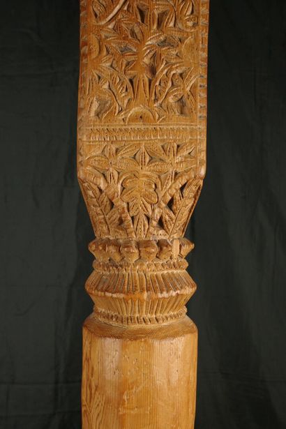 Two carved pine columns with consoles decorated...