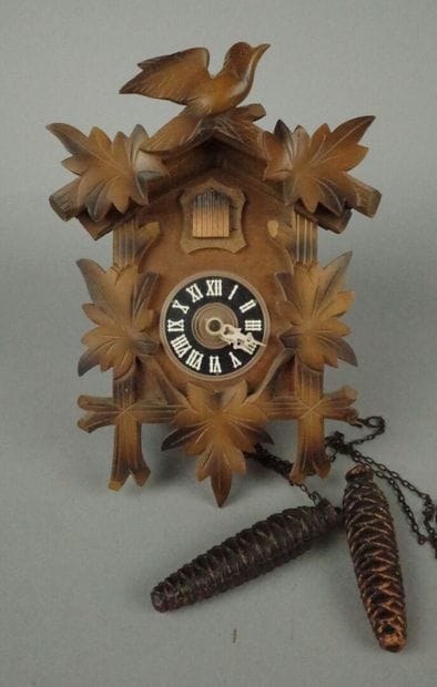 Black Forest-style wooden cuckoo clock with...