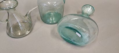 A shepherd's bottle in slightly bluish glass...
