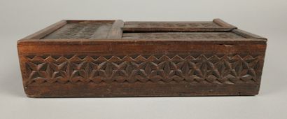 Set includes: - A carved wooden box with...