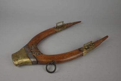 Wooden, brass, and leather donkey yoke with...