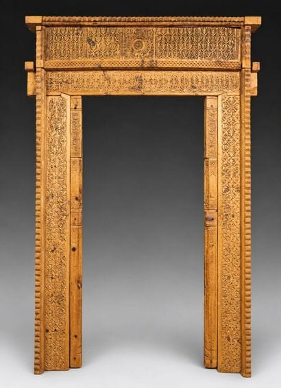 Antique wooden facade richly carved with...