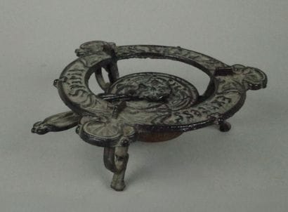Small cast-iron Art Nouveau-style three-legged...