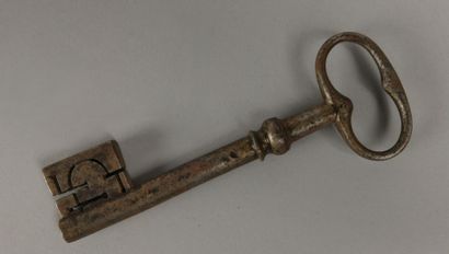 Wrought-iron key with an oval ring featuring...