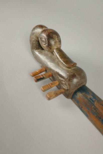 Set including a wooden rattle, a two-compartment...