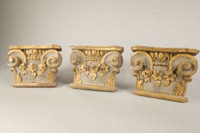 Three sections of Corinthian capitals made...